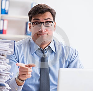 Extremely busy businessman working in office