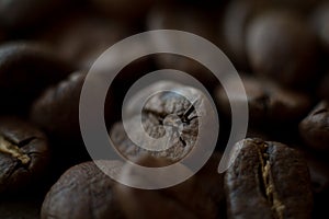 Extremely close-up background roasted coffee beans, good morning concept