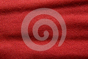 Extremely close-up. Red dense fabric, texture