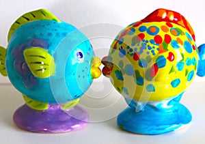 Extremely Colorful Fish Statuettes Pose Together
