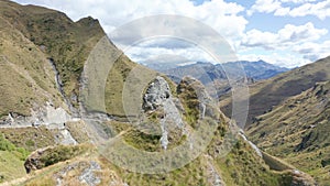 Extremely dangerous road in Skippers Canyon with mountains and valleys, New Zealand