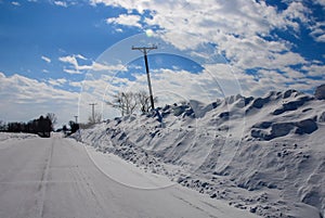 Extremely deep snowbanks pushed telephone pole crooked