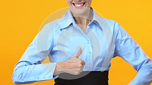 Extremely happy business woman showing thumbs up, career promotion, success