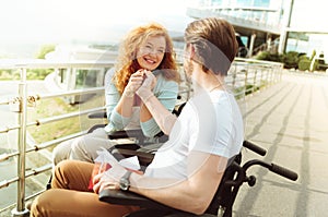 Extremely happy lady beaming while holding hand of husband