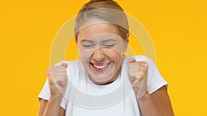 Extremely happy lady rejoicing jackpot winning, lottery player, fortune, closeup