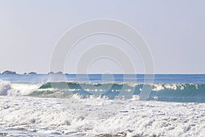 Extremely huge big surfer waves beach La Punta Zicatela Mexico