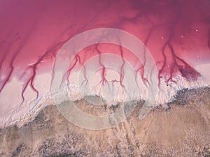 Extremely salty pink lake, aerial view, natural abstract background