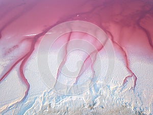 Extremely salty pink lake, aerial view, natural abstract background