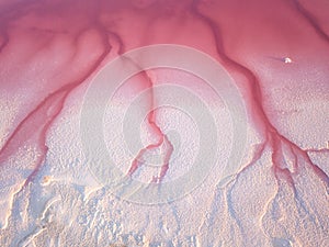 Extremely salty pink lake, aerial view, natural abstract background