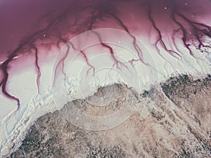 Extremely salty pink lake, aerial view, natural abstract background