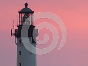 Extremity of a lighthouse in a pink sky to Biarritz in France