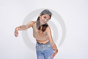 An extroverted young asian woman offers a hug while bending down, showing support and care. Isolated on a white background photo