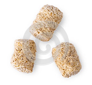 Extruded wheat bran pellets isolated on white