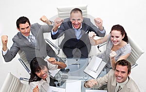 Exuberant business team celebrating a success photo