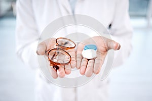 Eye care, choice with glasses or contact lens in hands, closeup and vision with healthcare for eyes. Prescription lenses