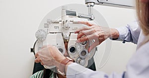 Eye care, machine and child in clinic, test and specialist, phoropter or refractor for girl. Healthcare, technology and