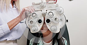 Eye care, vision and child in clinic, test and help of specialist, phoropter or refractor for girl. Healthcare