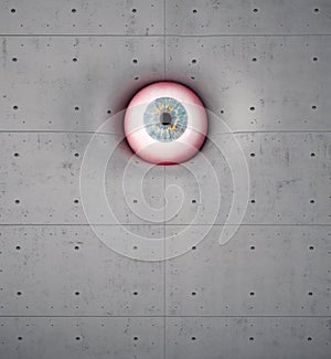 Eye on a concrete wall. Spying and supervision concept