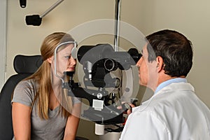 Eye Doctor Examining Patient