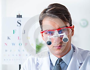Eye doctor in eyecare concept in hospital photo