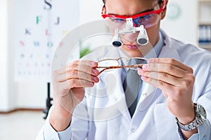 The eye doctor in eyecare concept in hospital photo