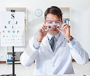 Eye doctor in eyecare concept in hospital photo