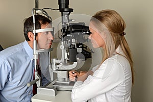 Eye Doctor With Patient During Exam