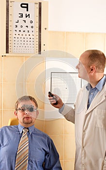 Eye doctor performing eye examination