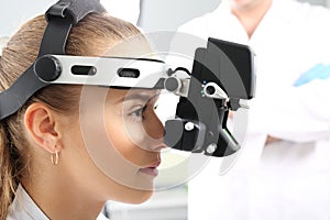 An eye exam at an ophthalmologist, ophthalmoscope