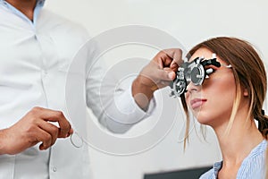 Eye Exam. Woman In Glasses Checking Eyesight At Clinic