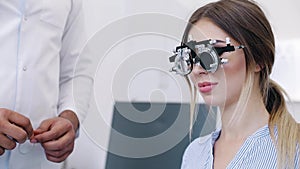 Eye Exam. Woman In Glasses Checking Eyesight At Clinic