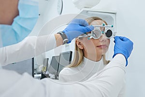 Eye Exam. Woman In Glasses Checking Eyesight At Clinic