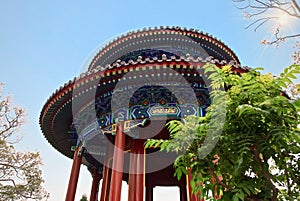 Eye Feasting Pavilion in Jingshan Park. round two-tier roof, pointed to the top. traditional chinese architecture.