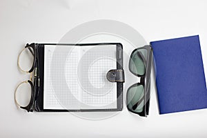 Eye glasses, blank notepad