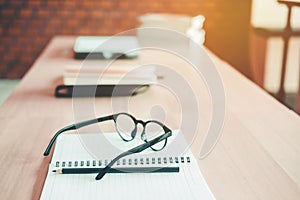 Eye Glasses on the study table education concept