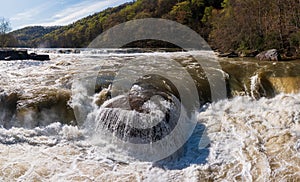 Eye level view of raging flooded Valley Falls near Fairmont