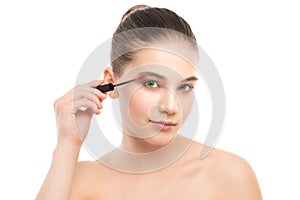 Eye make up apply. Mascara applying closeup, long lashes. makeup brush. Isolated.