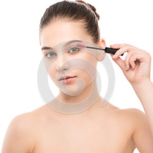 Eye make up apply. Mascara applying closeup, long lashes. makeup brush. Isolated.