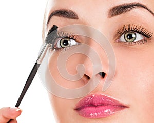 Eye makeup. Applying mascara on the lashes.