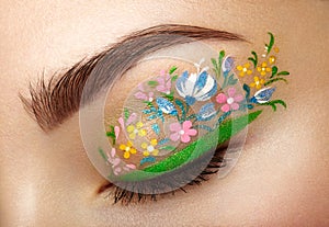 Eye makeup girl with a flowers