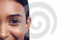 Eye, mockup and half face with an indian woman in studio isolated on a white background for beauty marketing. Portrait