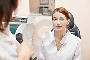 Eye ophthalmologist exam. Eyesight recovery. Astigmatism check concept. Ophthalmology diagmostic device. Beauty girl portrait in