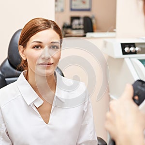 Eye ophthalmologist exam. Eyesight recovery. Astigmatism check concept. Ophthalmology diagmostic device. Beauty girl portrait in