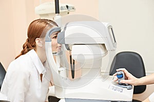 Eye ophthalmologist exam. Eyesight recovery. Astigmatism check concept. Ophthalmology diagmostic device. Beauty girl portrait in