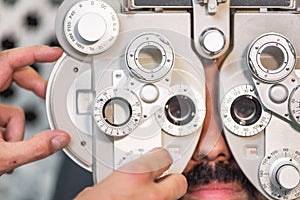 Eye ophthalmologist exam. Eyesight recovery. Astigmatism check concept. Ophthalmology diagnostic device.