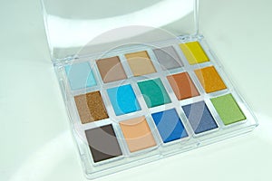 Eye shadow palette on a white background, close-up.