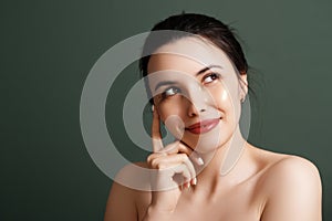 Eye Skin Beauty. Closeup Of Beautiful Young Woman Face With Natural Makeup. Under eye masks for puffiness photo