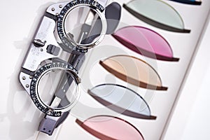 Eye test frame for optician with many different colored trial lenses for eye protect