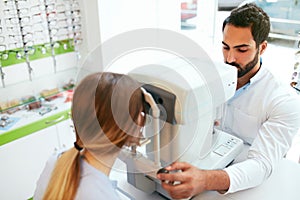 Eye Test. Optometrist Testing Woman Eyesight On Modern Equipment