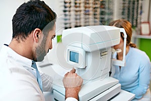 Eye Test. Optometrist Testing Woman Eyesight On Modern Equipment